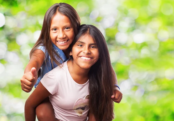 Two sisters play games - a Royalty Free Stock Photo from Photocase