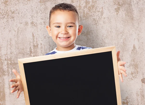 Χαριτωμένο παιδί εκμετάλλευση Μαυροπίνακας — Φωτογραφία Αρχείου