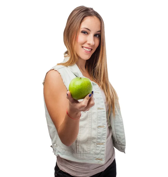 Pretty young woman offering apple — Stock Photo, Image