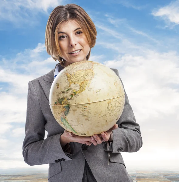 Business young woman holding globe — Stock Photo, Image
