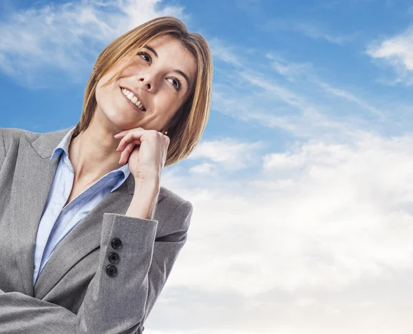 Executive young woman in pensive gesture — Stock Photo, Image