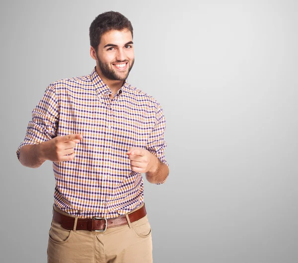 Schöner junger Mann zeigt — Stockfoto