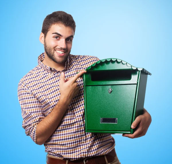 Schöner junger Mann mit Malbox — Stockfoto