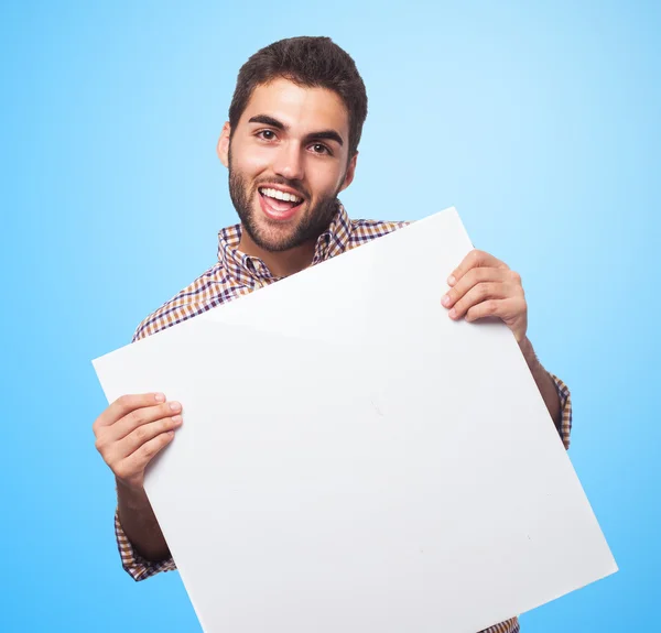 Joven sosteniendo pancarta — Foto de Stock