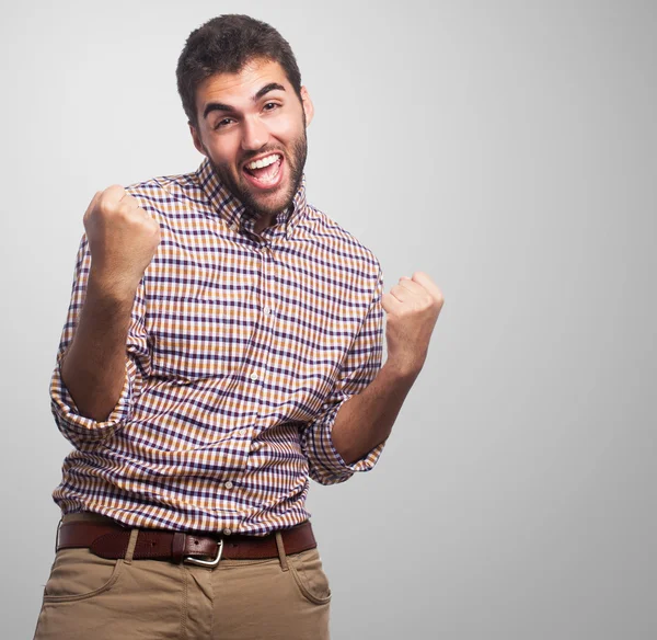 Young man doing victory gesture — Stock Photo, Image