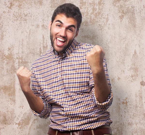 Young man doing victory gesture — Stock Photo, Image