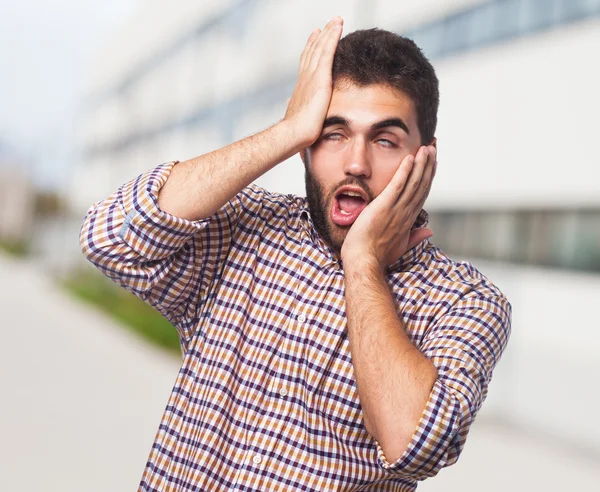 Joven haciendo un gesto loco — Foto de Stock