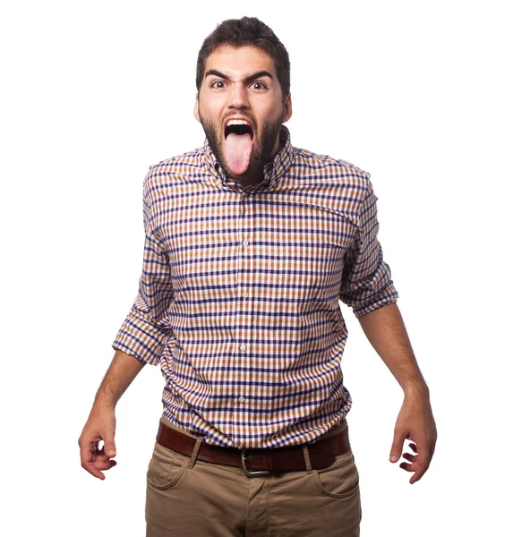 Young man showing his tongue — Stock Photo, Image