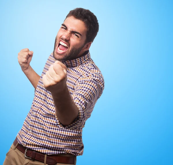 Handsome man doing victory gesture — Stock Photo, Image