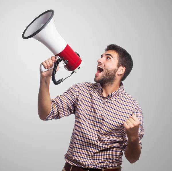 Handsome man shouting with megaphone — Stock Photo, Image