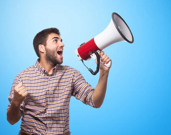 Hombre guapo gritando con megáfono —  Fotos de Stock