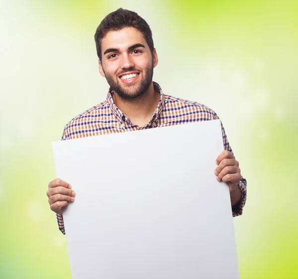 Joven sosteniendo pancarta — Foto de Stock