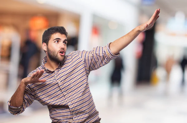 Positive man doing victory gesture — Stock Photo, Image