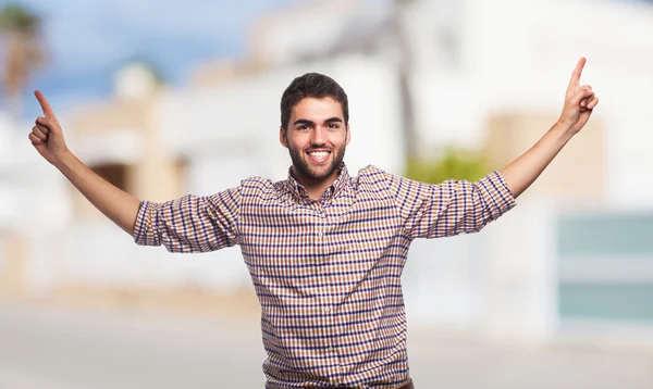 Young man pointing up