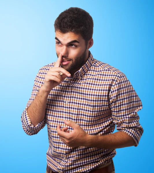 Jonge man met vinger in de neus — Stockfoto