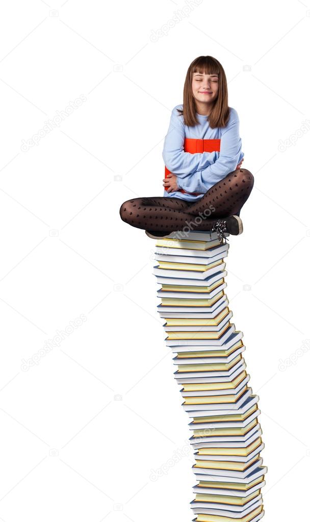 Young woman hugging book