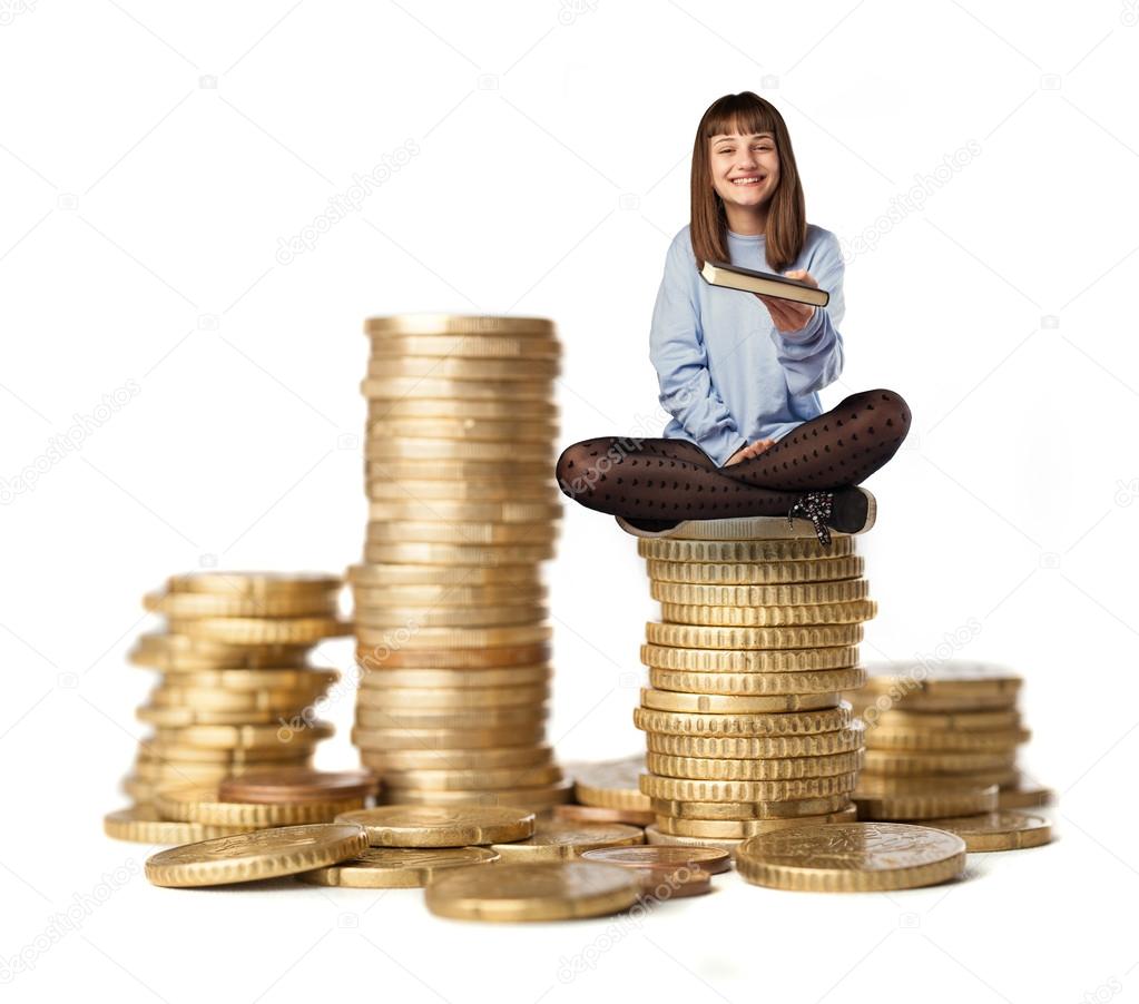 Young woman sitting on coins tower