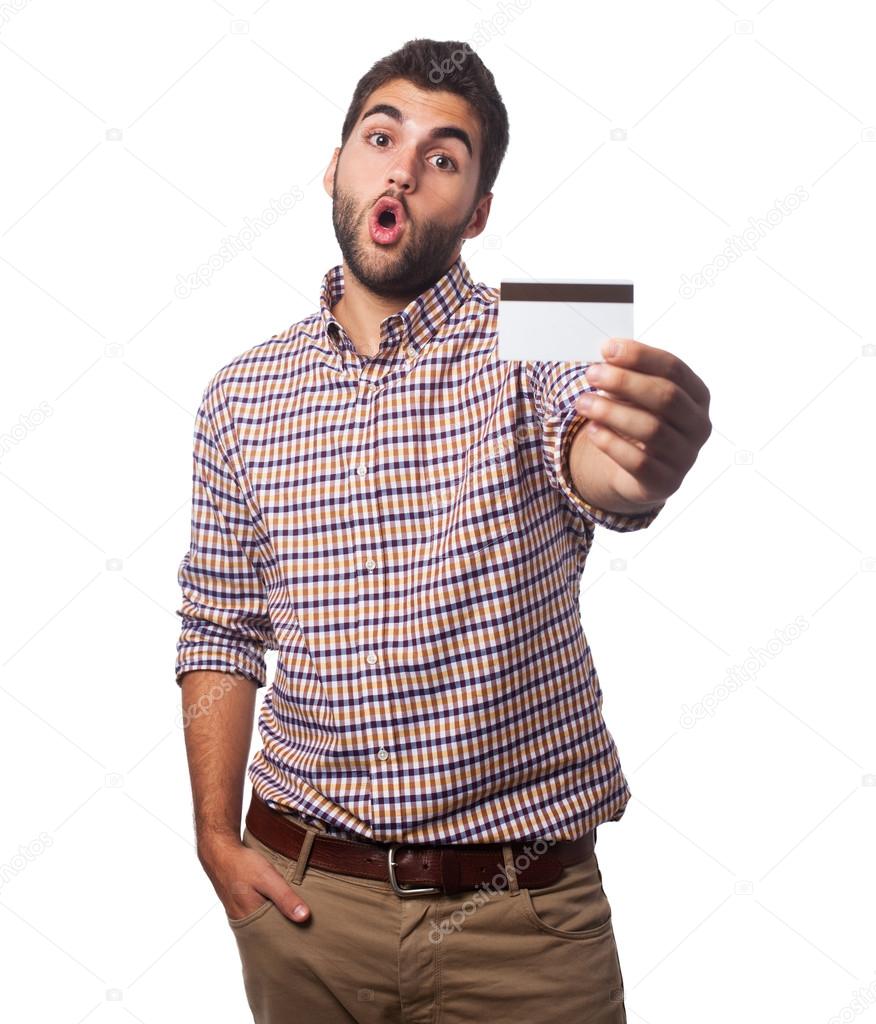 Young man holding credit card