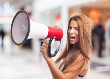 Woman shouting with a megaphone clipart