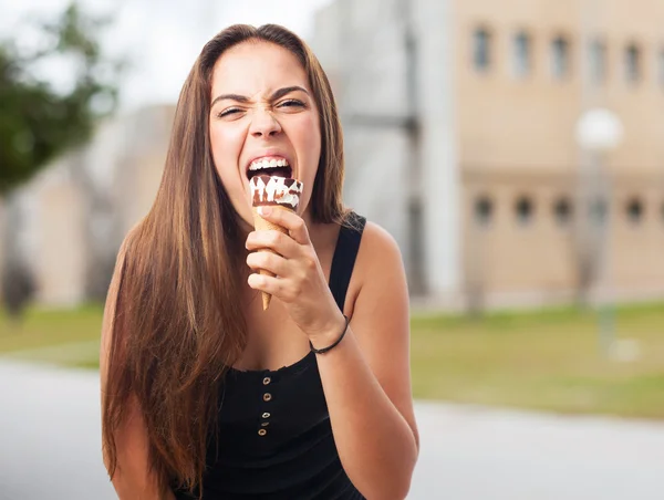 Woman licking an ice cream — Stock Photo, Image