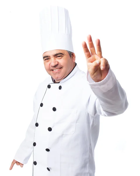 Cook man doing a number three — Stock Photo, Image