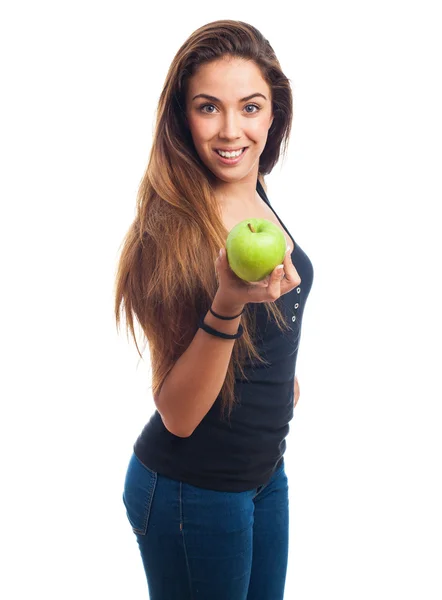 Kvinna som håller i ett grönt äpple — Stockfoto