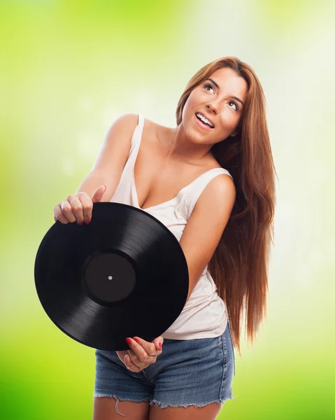 Woman holding a vinyl — Stock Photo, Image