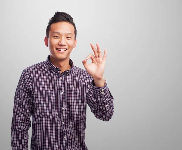 Asian man doing the okay gesture — Stock Photo, Image