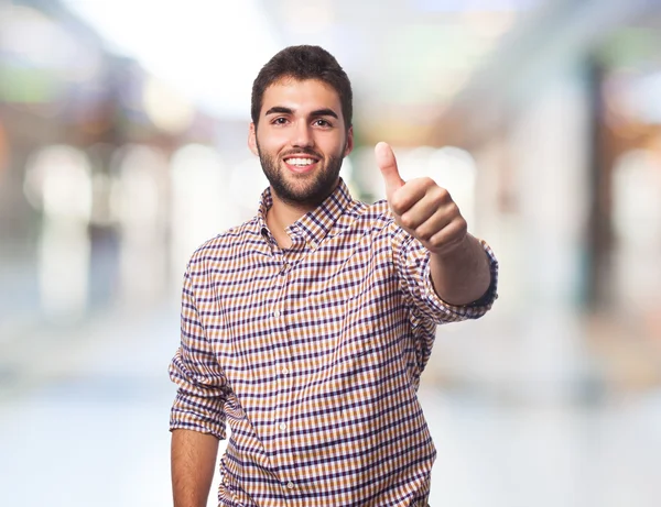 Young man with thumb up — Stock Photo, Image