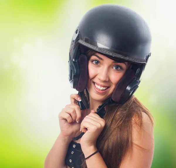 Woman clasping her helmet — Stock Photo, Image