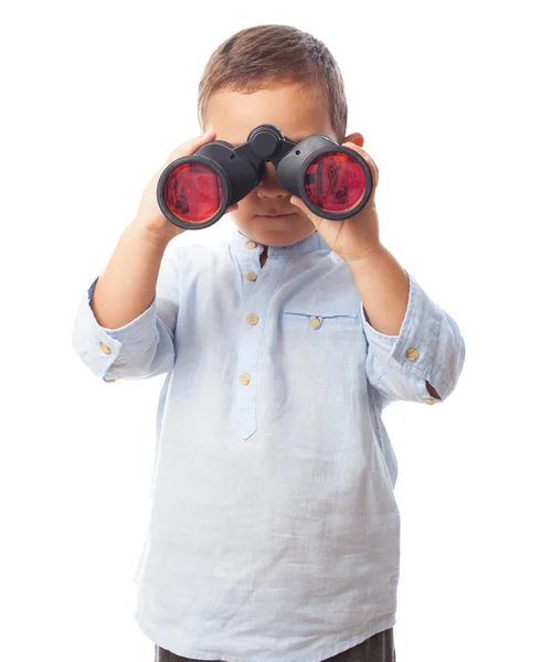 Boy looking through the binoculars — Stock Photo, Image