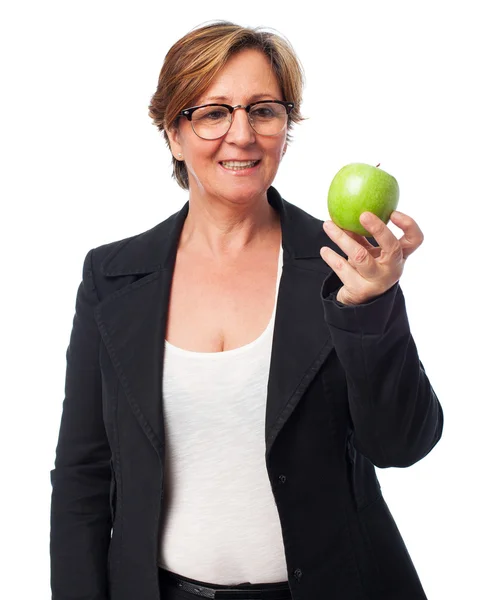 Woman holding an apple — Stock Photo, Image