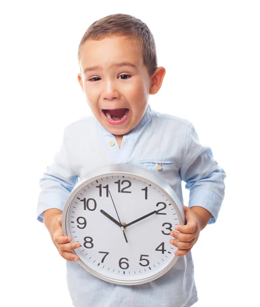 Boy holding a clock — Stock Photo, Image