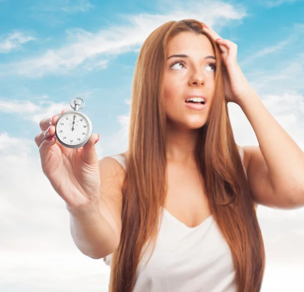 Woman holding a stopwatch — Stock Photo, Image