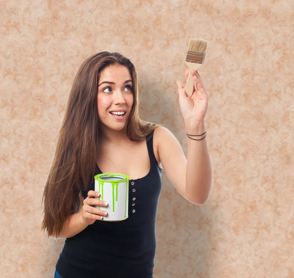 Woman holding a paint can — Stock Photo, Image