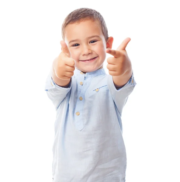 Little boy doing the victory gesture — Stock Photo, Image