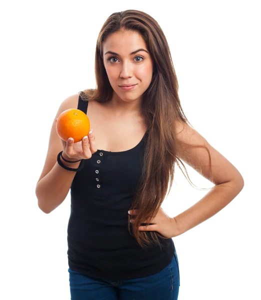 Girl holding an orange — Stock Photo, Image