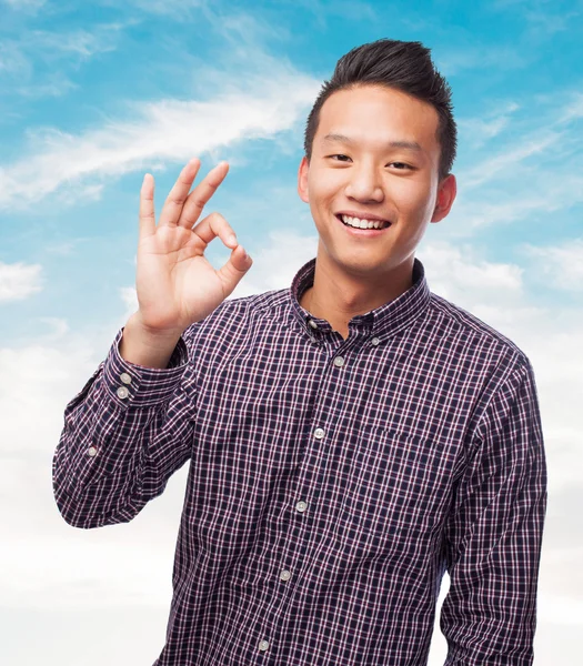 Asian man doing the okay gesture — Stock Photo, Image