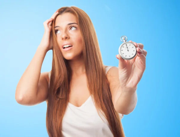 Woman holding a stopwatch — Stock Photo, Image