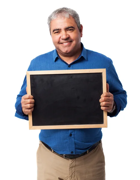 Man die een schoolbord — Stockfoto