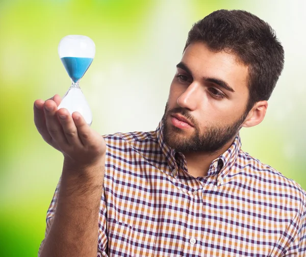 Man holding a sand timer — Stock Photo, Image