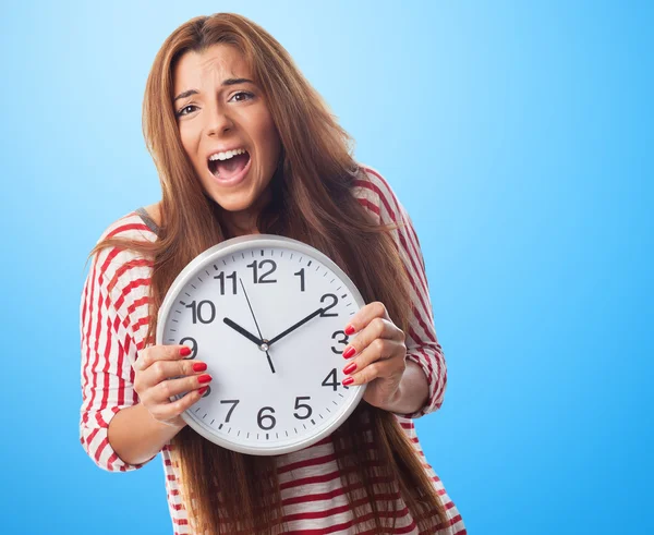 Woman holding a clock — Stock Photo, Image