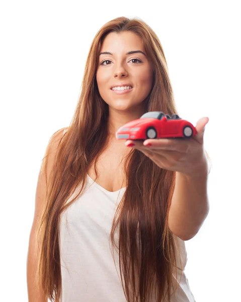 Young woman with a car toy — Stock Photo, Image