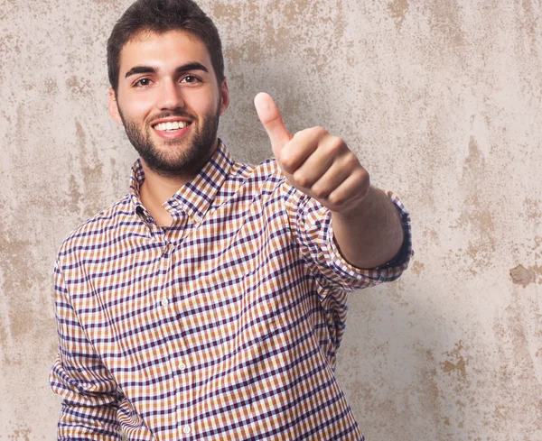 Young man with thumb up — Stock Photo, Image