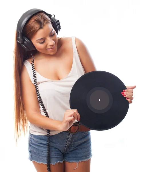 Mujer joven sosteniendo un vinilo —  Fotos de Stock