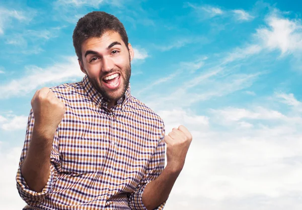 Man doing a victory gesture — Stock Photo, Image