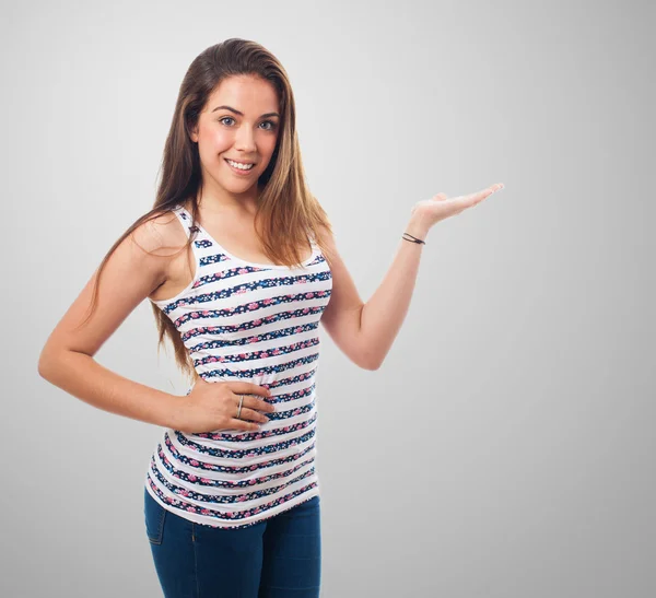Žena držící gesto nad pozadím — Stock fotografie