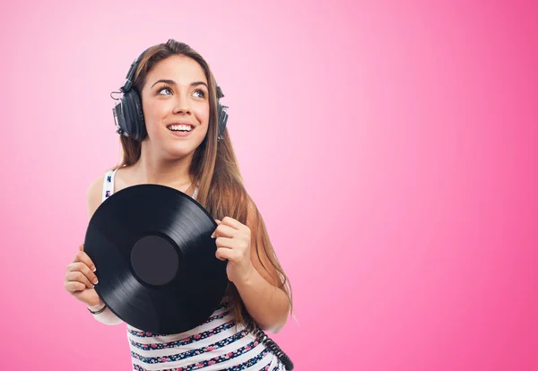 Chica sosteniendo un vinilo —  Fotos de Stock