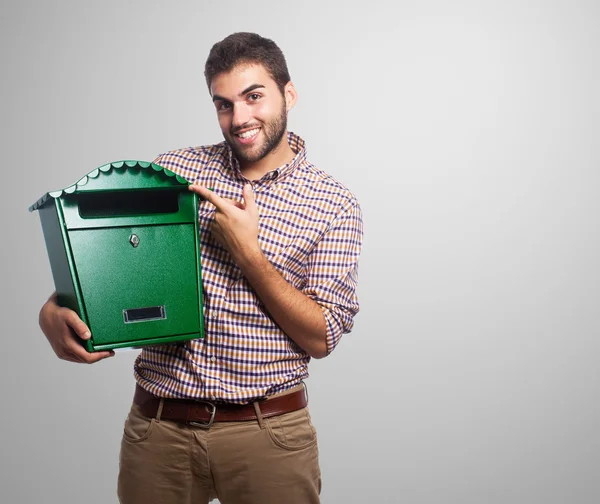 Man holding a mailbox — Stock Photo, Image