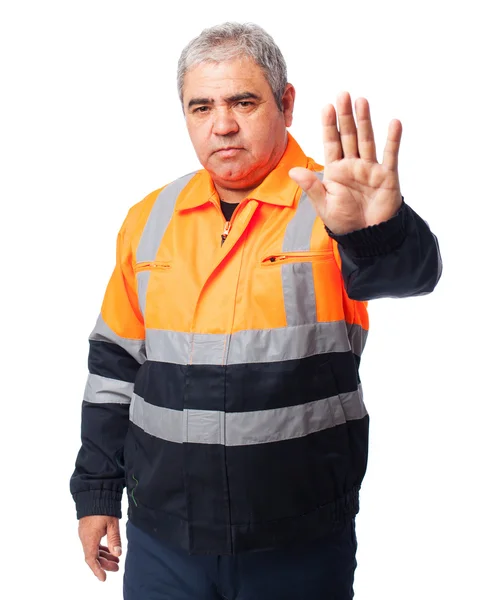 Worker doing a stop symbol — Stock Photo, Image